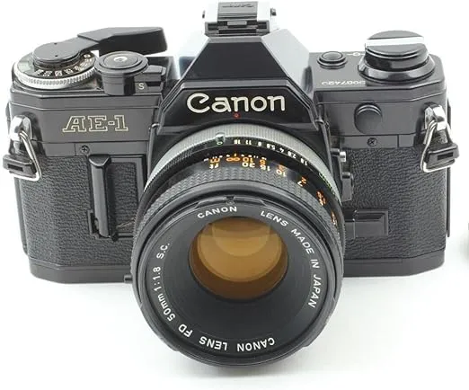 Canon AE-1 35mm SLR Film Manual Focus Camera (Black) with 50MM Canon FD mount lens. (Renewed)